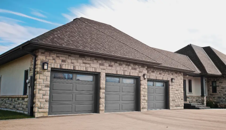 3 grey garage doors